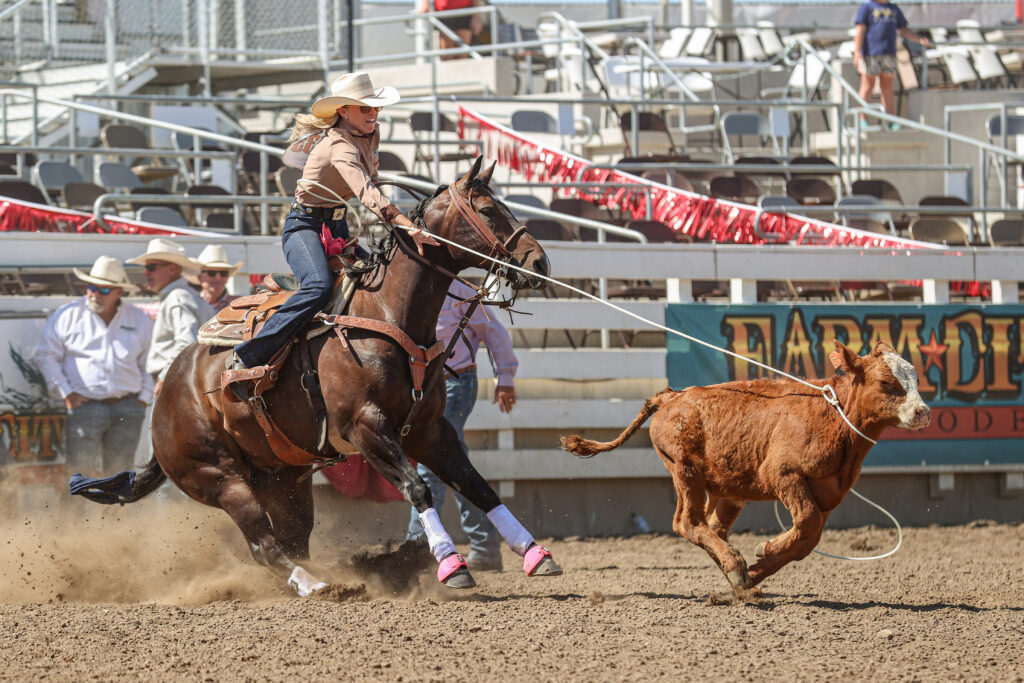 Aspen Miller breaking away on a calf in the slack at Hermiston, Oregon.