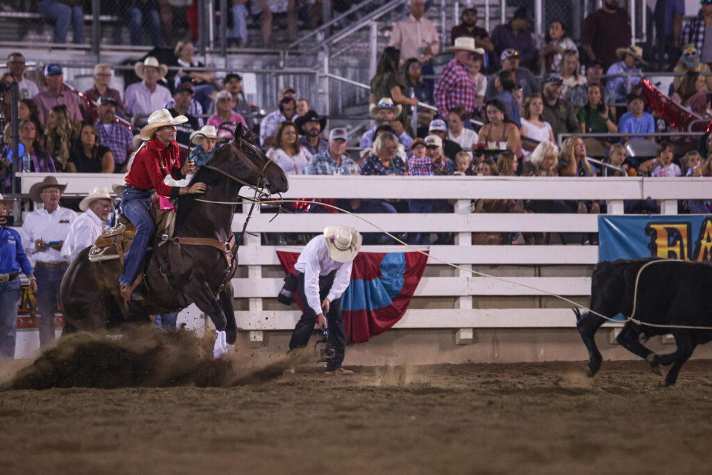 Aspen Miller breaking away on a calf at the Farm-City Pro Rodeo in Hermiston, Oregon, where she won the 2026 average.