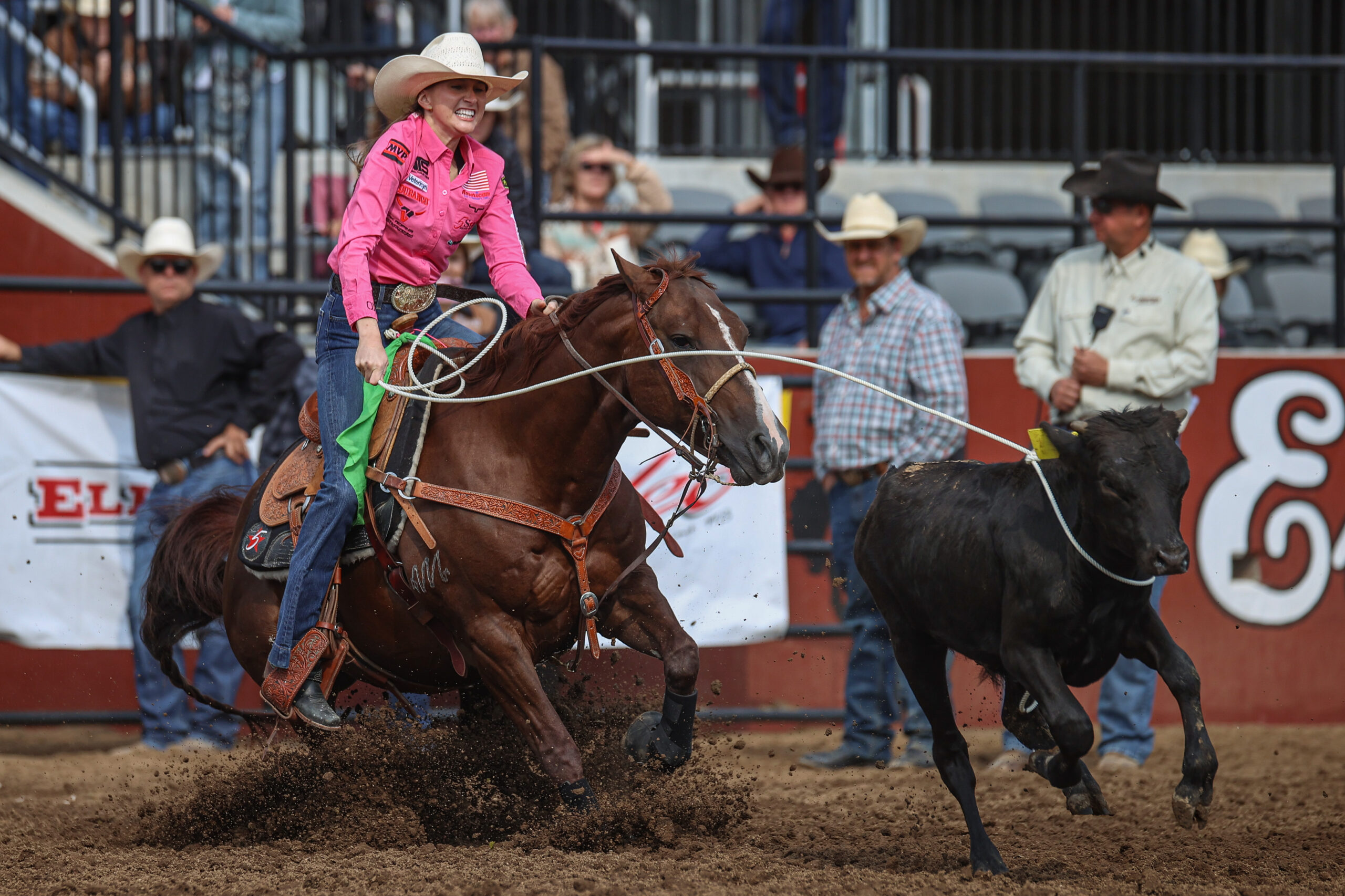 Josie Conner and Checkers pulling the slack of the calf to win the first round of Ellensburg, Washington.