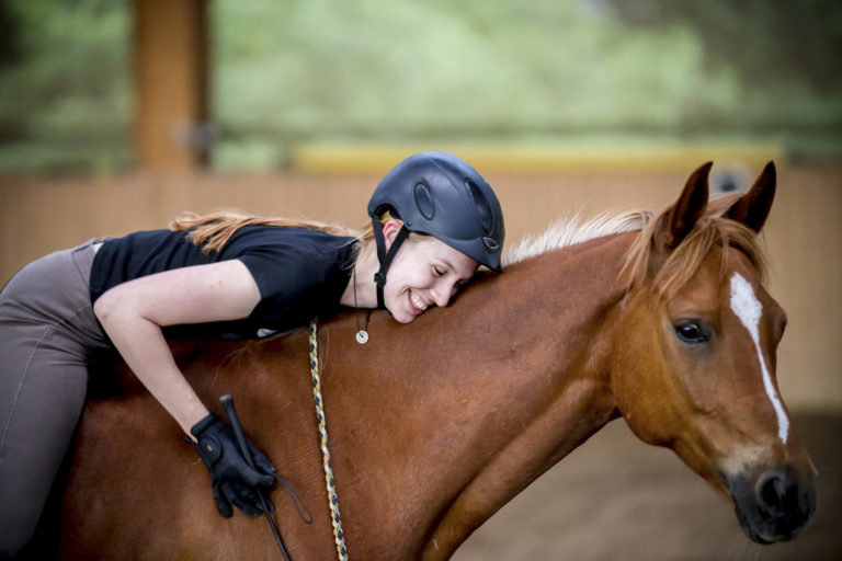 woman bareback bridleless happy