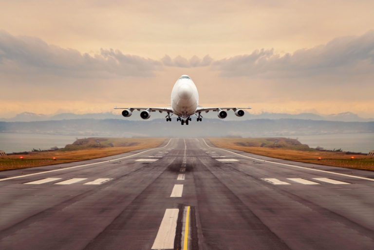 cargo plane airstrip ocean background