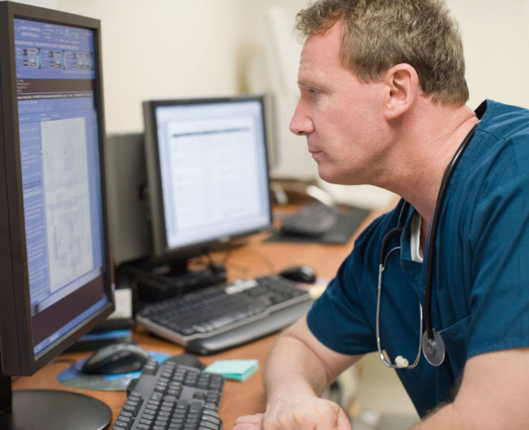 veterinarian look at computer