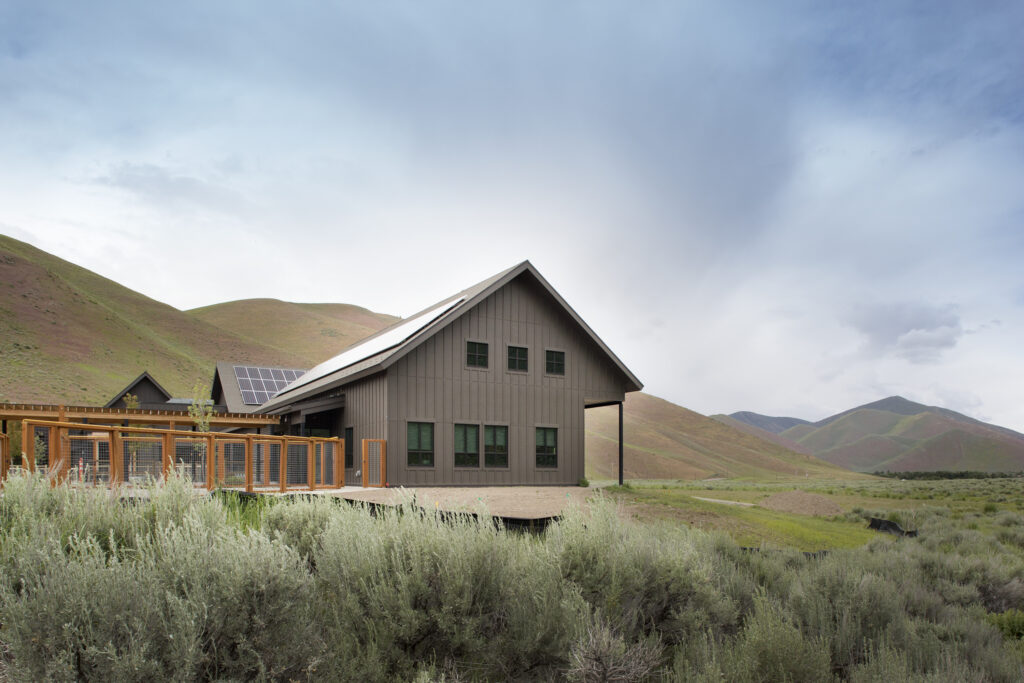 This Animal Arts project in Idaho features solar panels on top of the roofing system. 