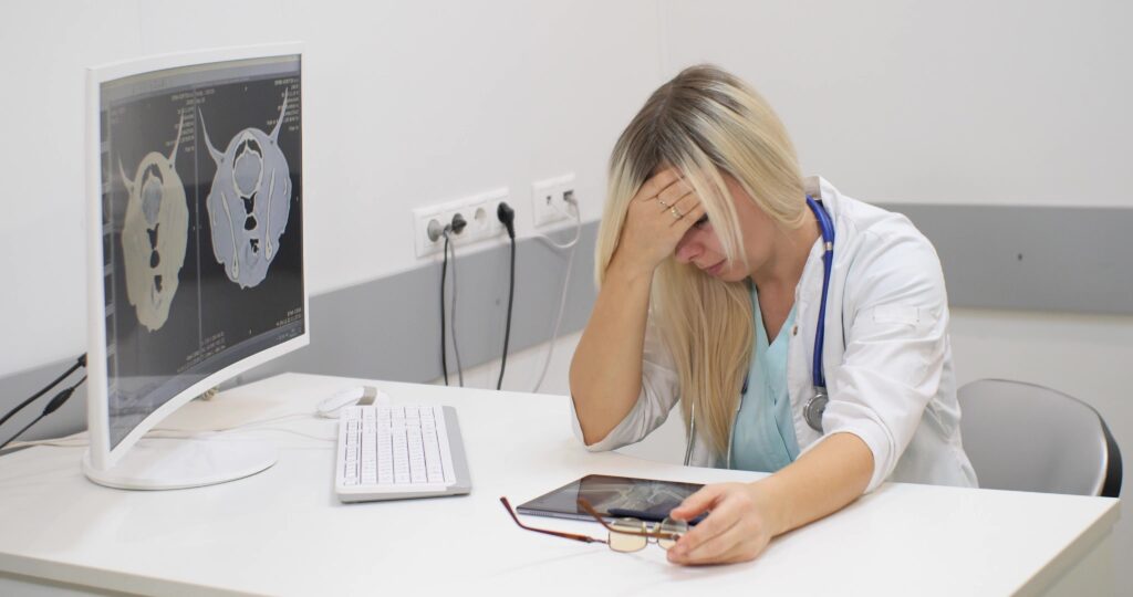 Veterinarian experiencing compassion fatigue