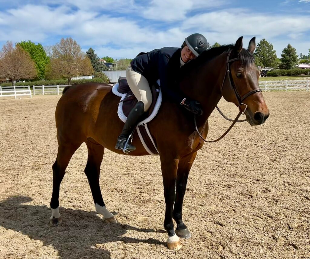 Dr. Sarah Reuss riding her horse.