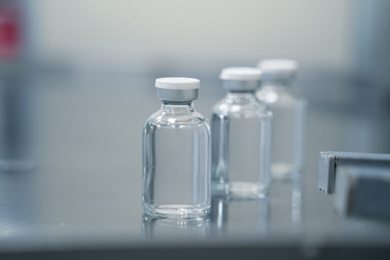 Rows of sterile bottles in a pharmaceutical factory