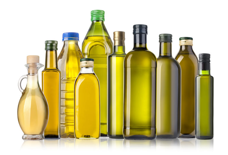 A collection of bottles filled with oil
