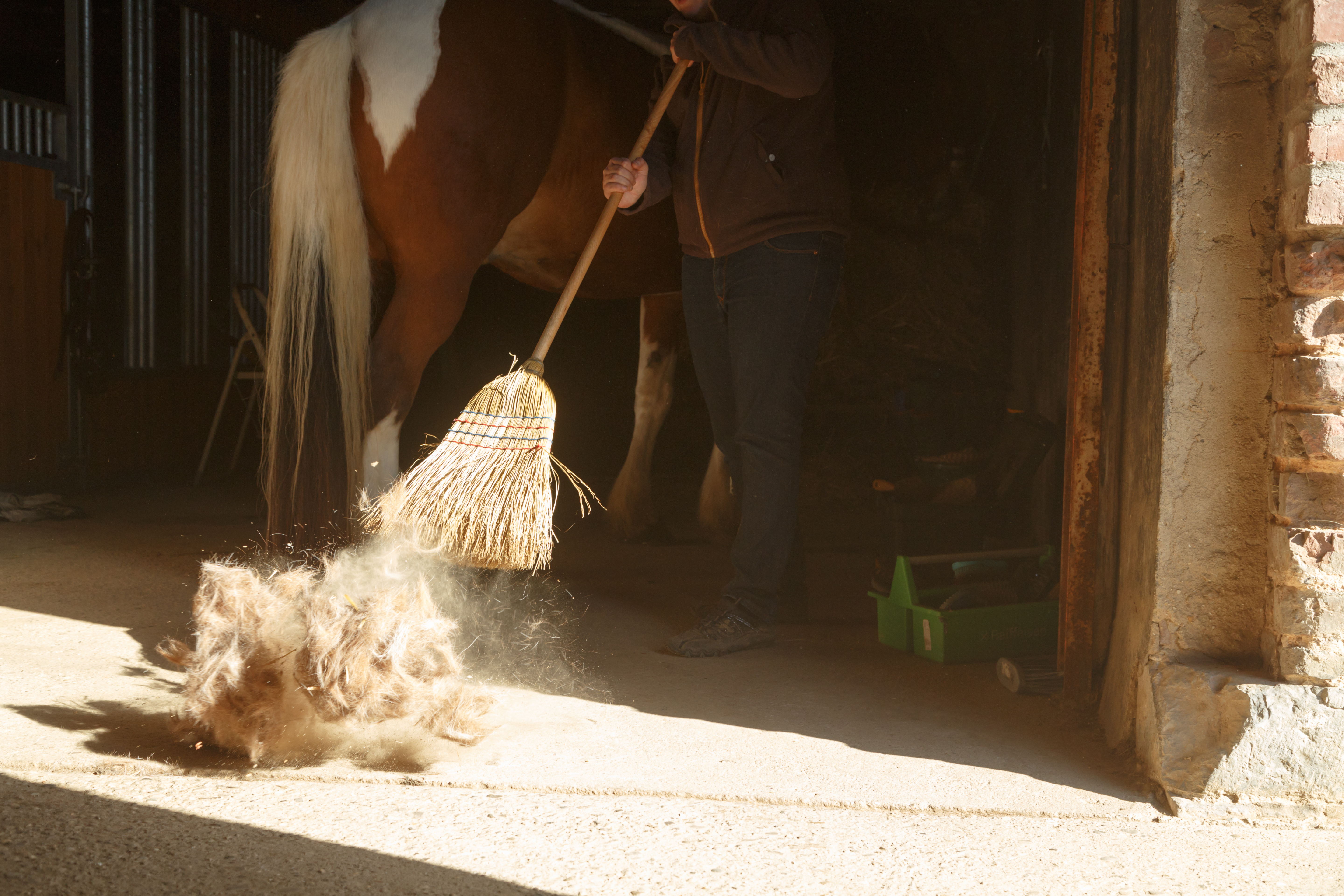 sweeping in a barn