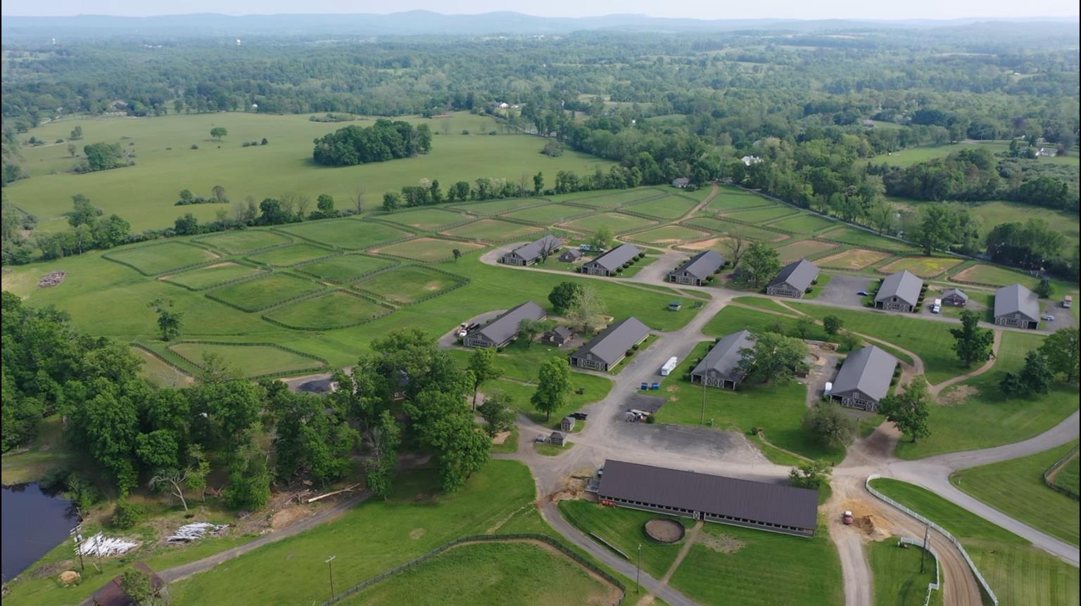 Overhead image of racehorse training faclity, including stables