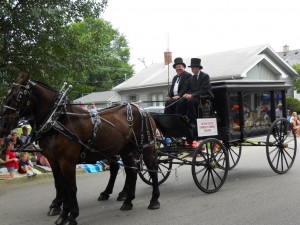 The Anderson-Poindexter Funeral Home drives an old, wagon style hearse in the parade each year
