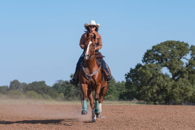 Jordon Briggs riding her barrel horse