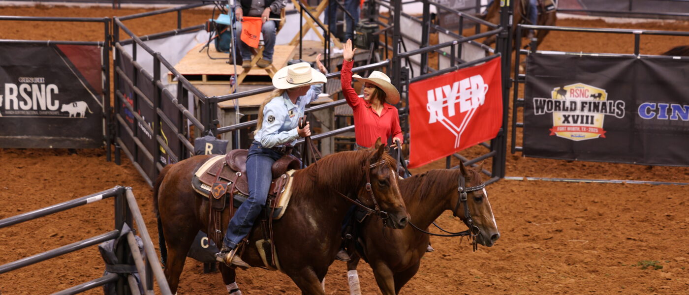 Two young cowgirls celebrate their ranch sorting run at the Cinch RSNC World Finals 2025