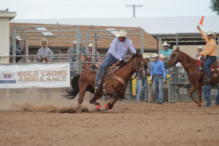 Jake Barnes Reaching in Team Roping