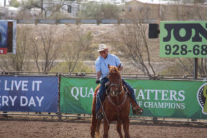 Earl Higgins smiles after roping a steer at Rancho Rio.