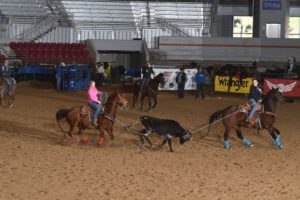 Women's Rodeo World Championship team ropers Beverly Johnson and Jessy Remsburg rope a steer to win the 2022 Amarillo All-Girl Roping.