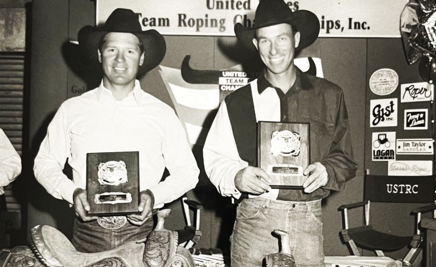 Jake Barnes and Clay O'Brien Cooper pose with their buckles.