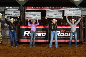The champions of the 2023 Women's Rodeo World Championship pose with their checks.