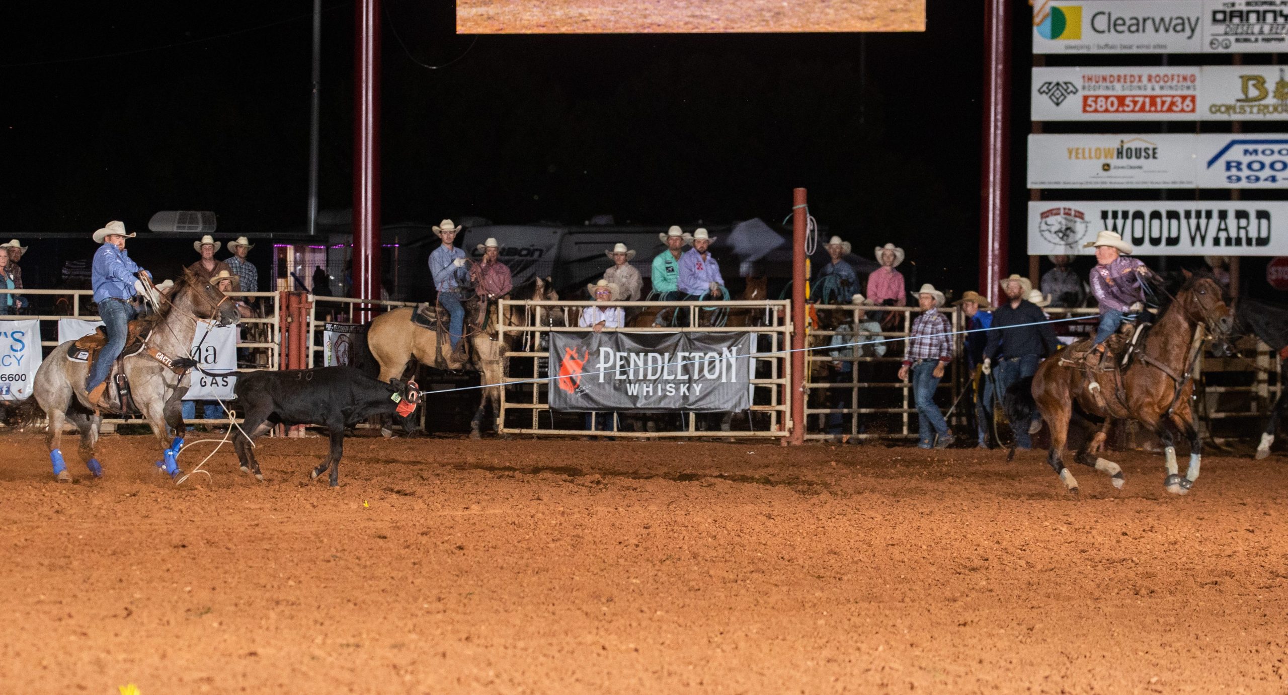 Clint Summers and Jake Long roping their steer in Woodward in 2023.