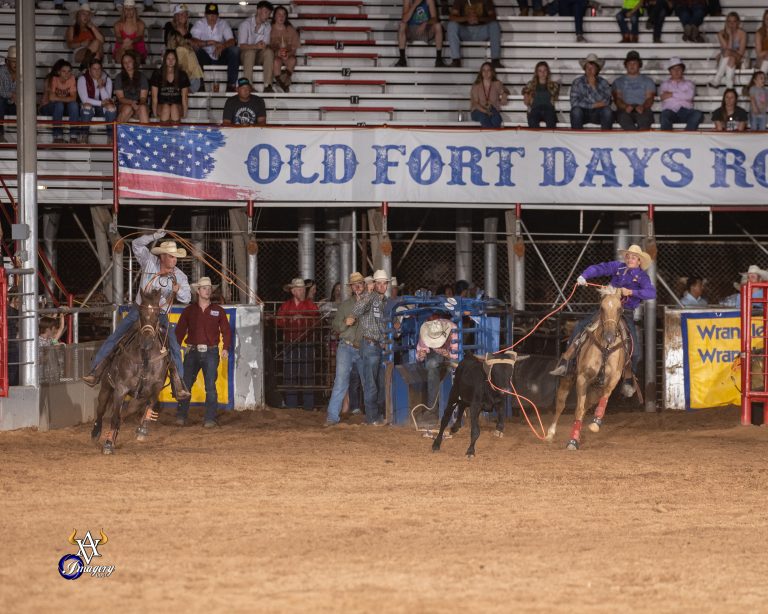 Kolby Krieger heading a steer for Rich Skelton at Fort Smith, Arkansas, in 2023.