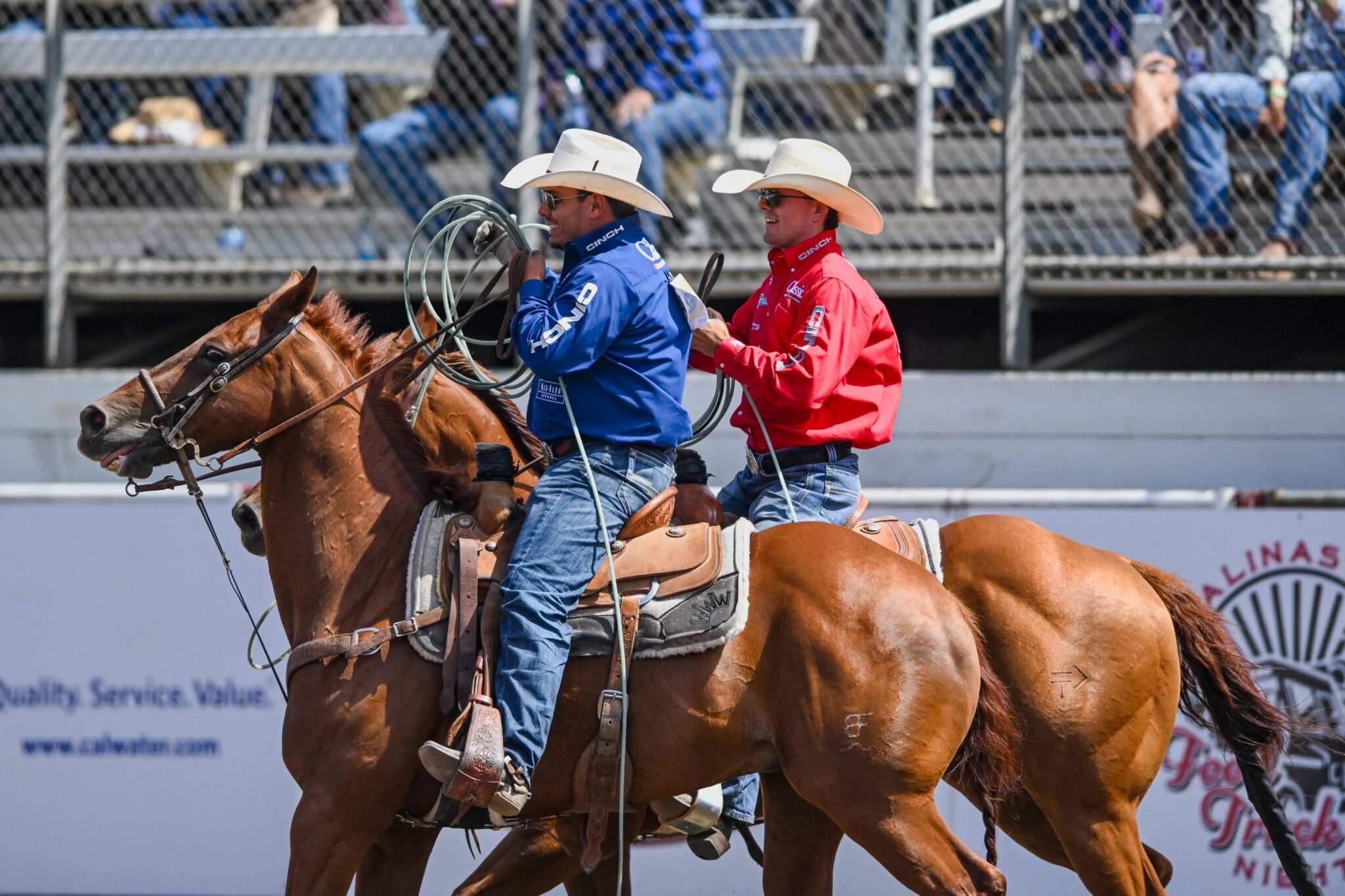 Coy Rahlmann and Jonathan Torres riding out of the arena after winning the 2023 California Rodeo Salinas.