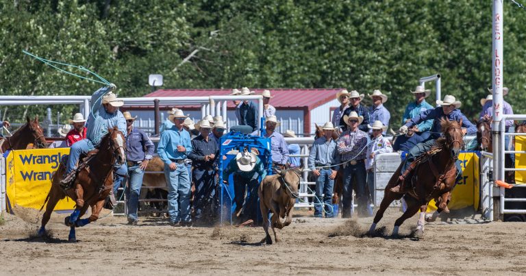 Mason Appleton sticks one on the steer as Cooper Freeman brings up the rear in Red Lodge, MT