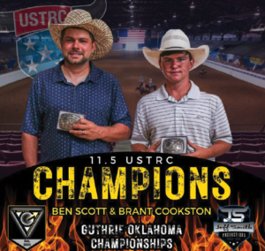 Brant Cookston and Ben Scott standing shoulder to shoulder holding trophy buckles.