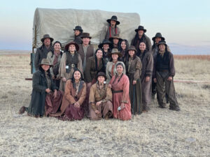 Dustin Bird, his brothers, and fellow Blackfeet Indian cast mates pose in costume on the set of 1883.