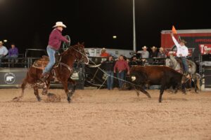 Stephen Britnell heeling a steer to win Round 1 of 2023 WCRA Rodeo Carolina.