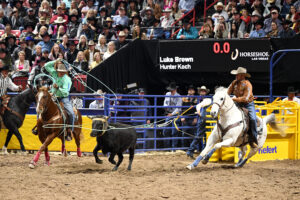 Luke Brown heading a steer for Hunter Koch to win Round 5 of the 2023 NFR.