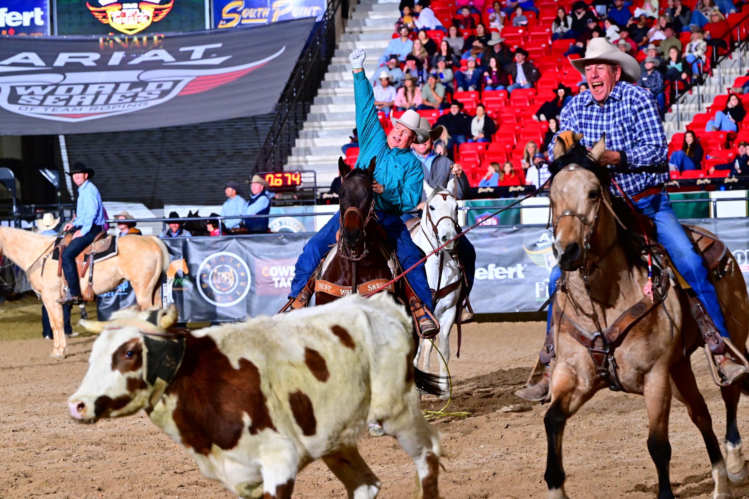 Charlie Robbins and Billy Resor celebrating their win of the 2023 Ariat World Series of Team Roping Apex #8.5 Finale.