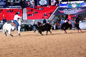 Bubba Buckaloo and Nicky Northcott roping their steer to win the 2023 Ariat World Series of Team Roping Riata Buckle Open Finale.