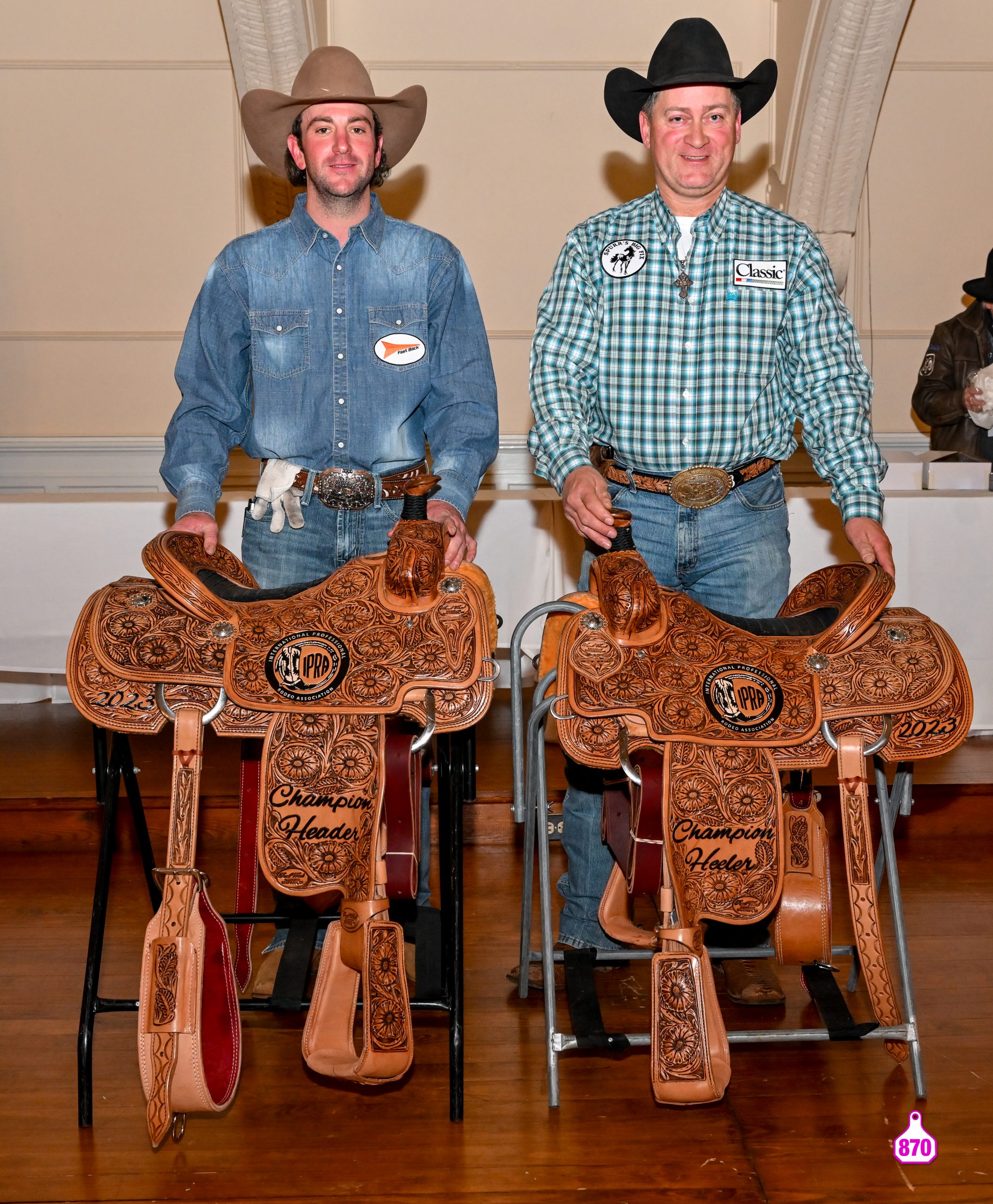 Heath King and Stephen Britnell pose with their 2023 IPRA world champion saddles.