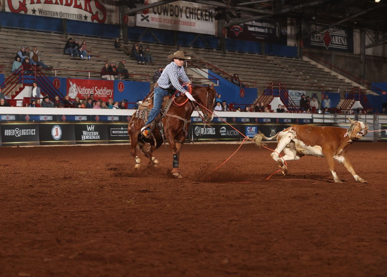 Bryer Hamilton heeling a steer at the 2024 WCRA Stampede at The E.