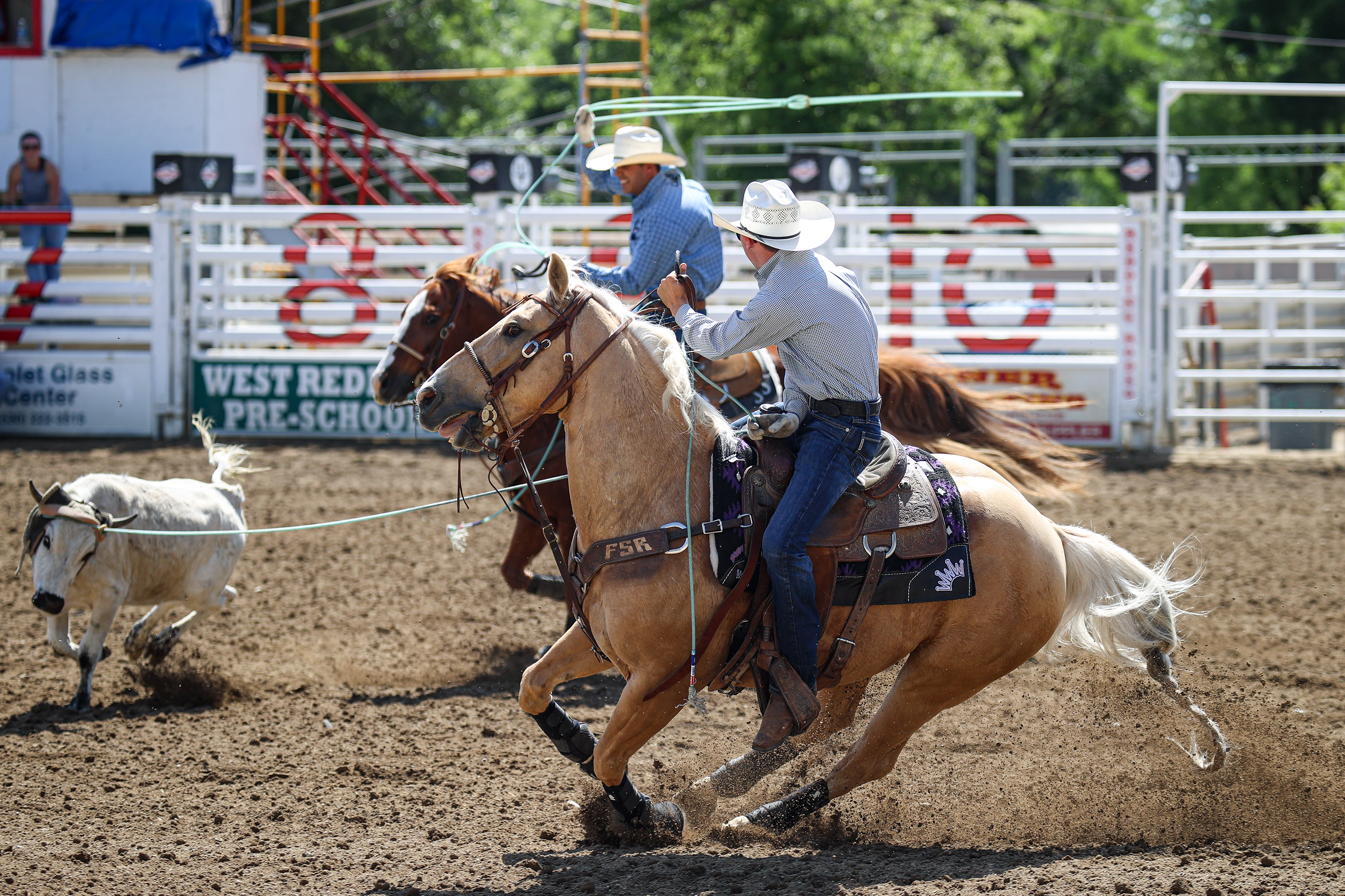 Jaxson Tucker turning a steer for Jason Johe at the 2024 Redding Rodeo