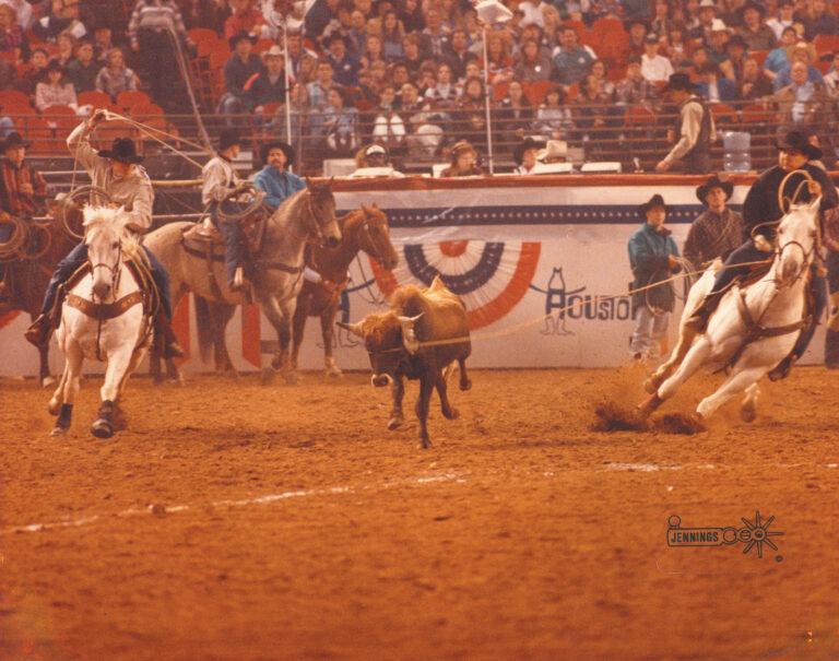 July_24_Jr Gonzales heads one at Houston in 95 on Hueros Gray Starsky for Wade Clayton on Permanent Glo