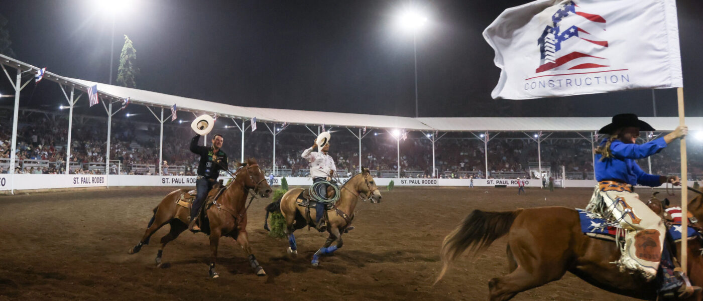 Kaleb Driggers and Junior Nogueira taking a victory lap at the 2024 St. Paul Rodeo.