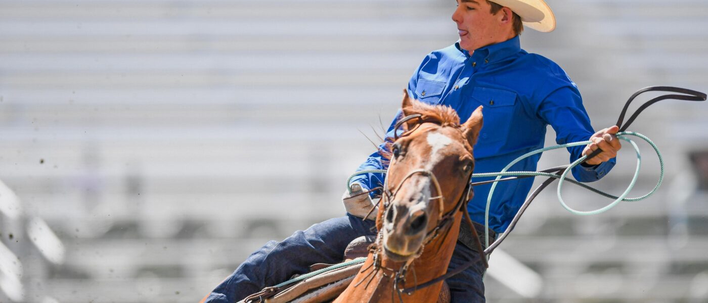 Tyler Tryan turning a steer for Logan Moore at the 2024 Reno Rodeo.