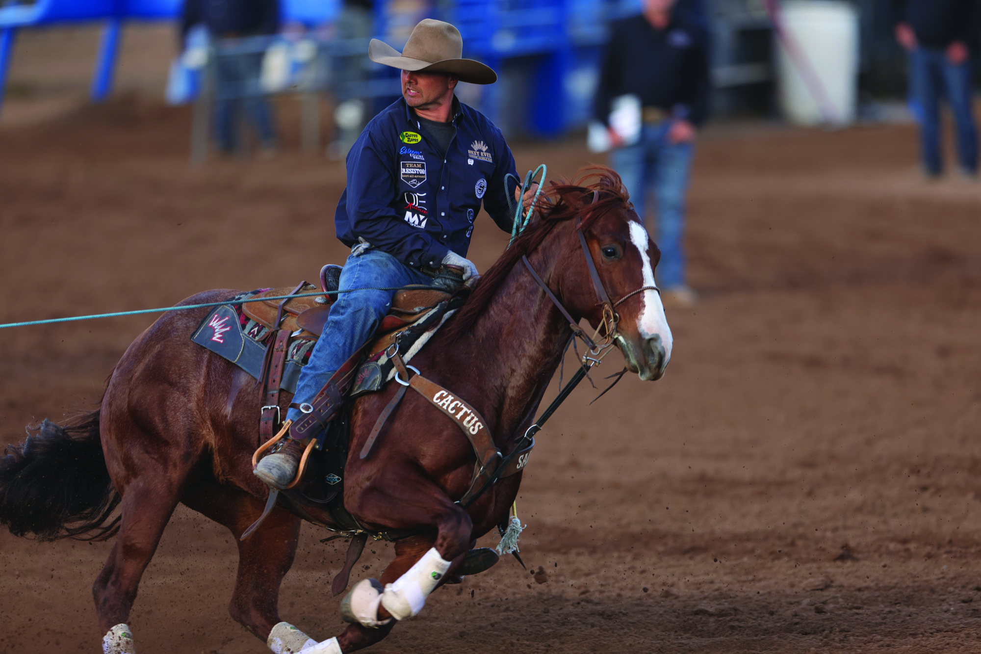 Andy Holcomb drawing his horse back up the arena