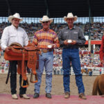 Jake Barnes and Clay O'Brien Cooper team roping at Cheyenne Frontier Days in 2002