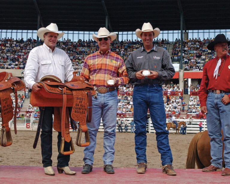 Jake Barnes and Clay O'Brien Cooper team roping at Cheyenne Frontier Days in 2002