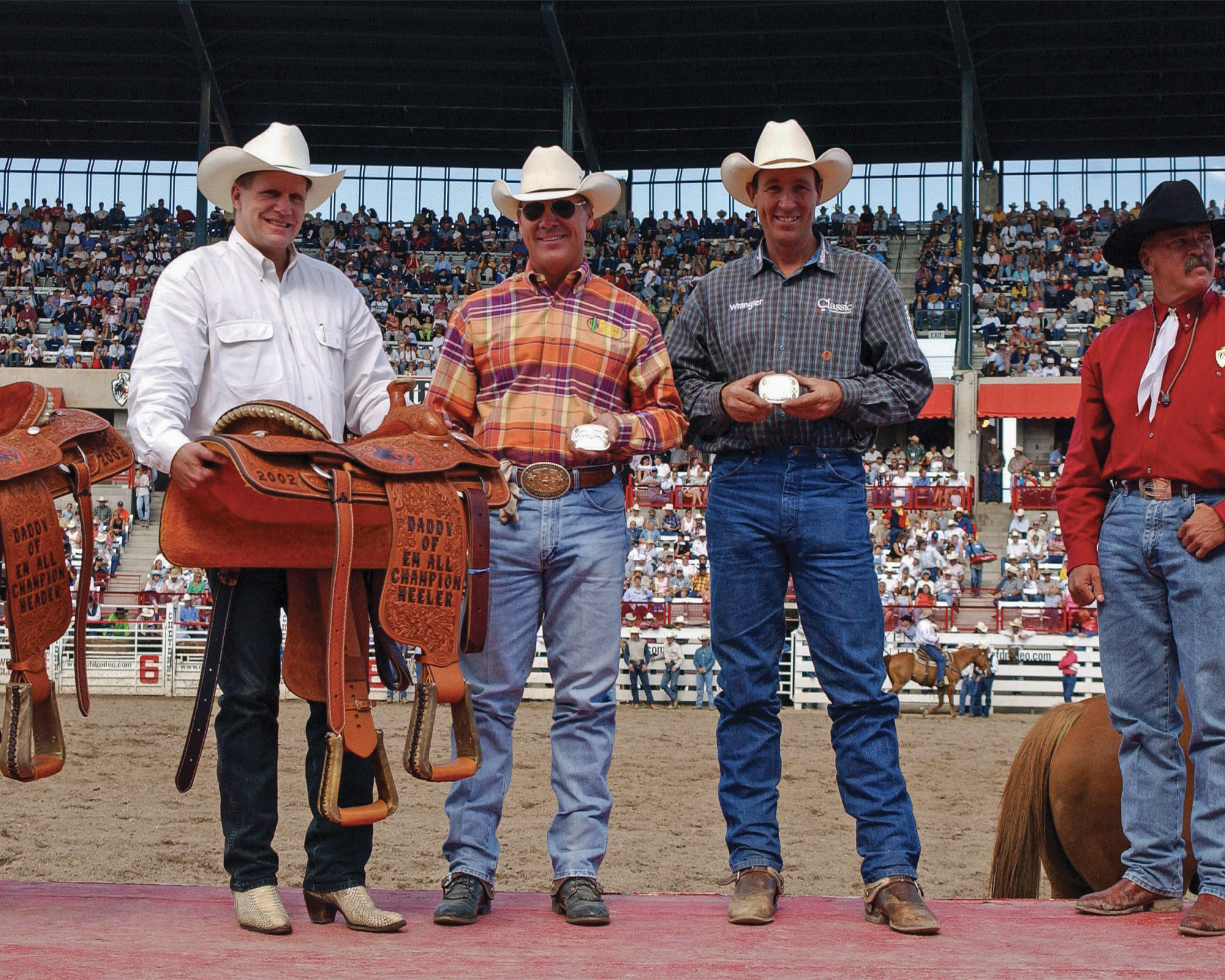 Jake Barnes and Clay O'Brien Cooper team roping at Cheyenne Frontier Days in 2002