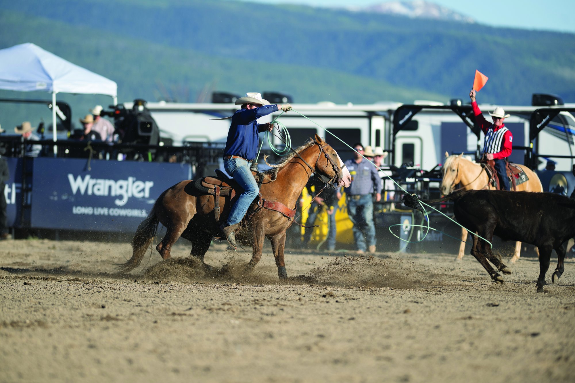 Trent Vaught heeling behind Cash Duty at the first pro rodeo held in Driggs, Idaho