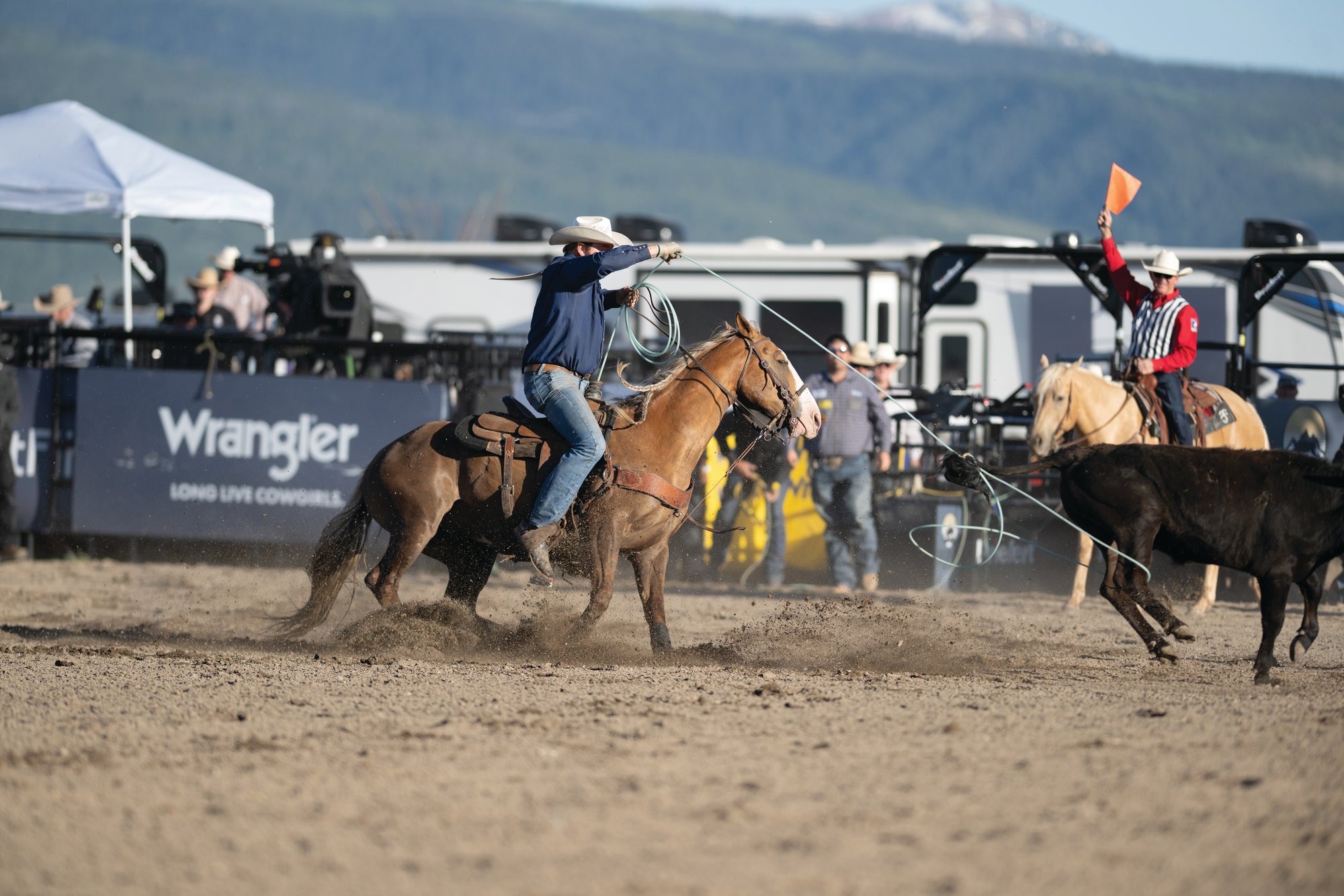 Trent Vaught heeling behind Cash Duty at the first pro rodeo held in Driggs, Idaho