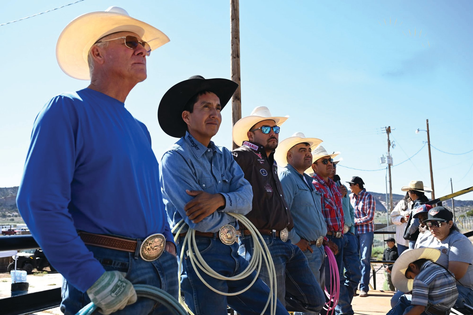 Clay Cooper, Derrick Begay, Erich Rogers, Ty Romo, Myles John and Aaron Tsinigine standing together with ropes at the Home of the Navajo PRCA Rodeo