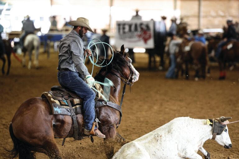 Dakota Kirchenschlager riding Smokin Stilettos at a roping