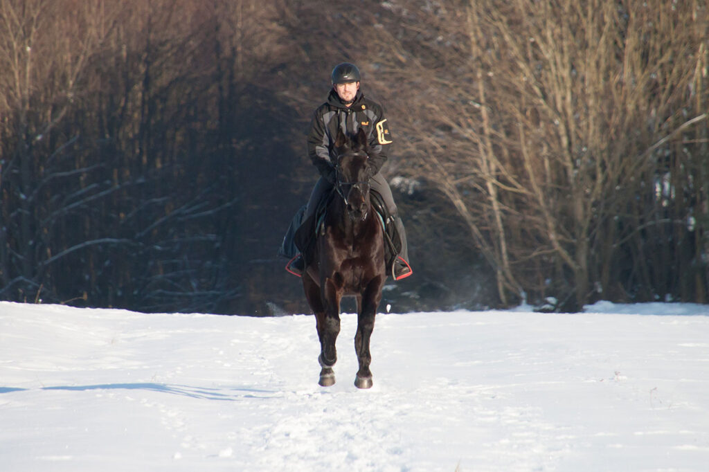 riding horse in snow