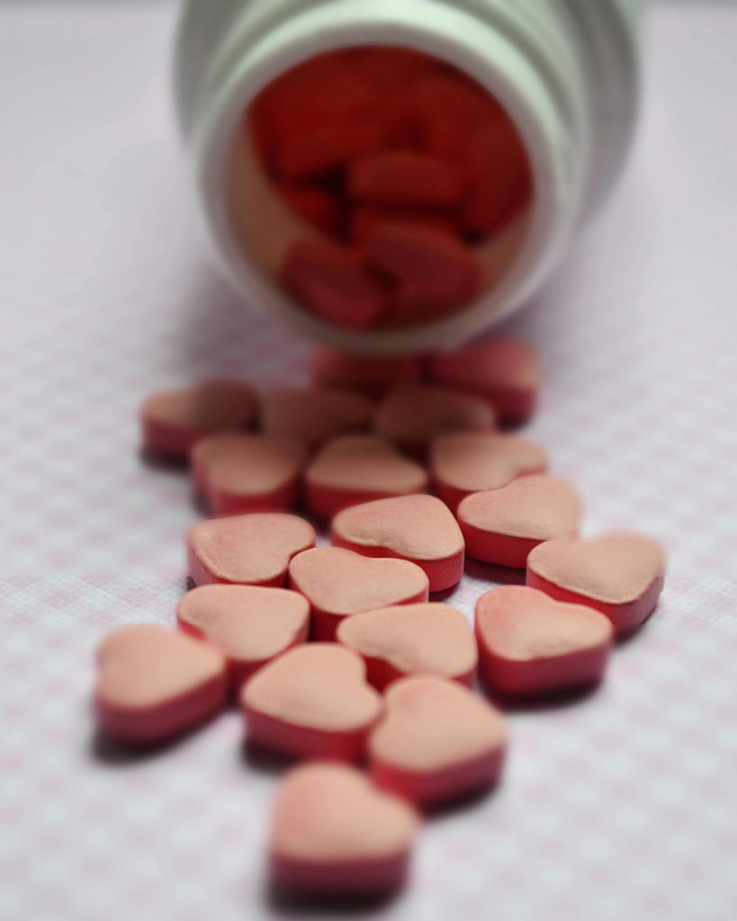 Selective focus photo of pink tablets