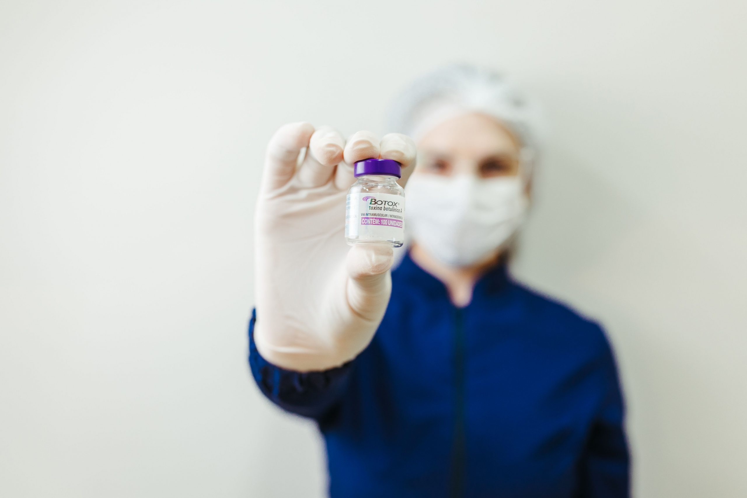 Woman holding botox flask