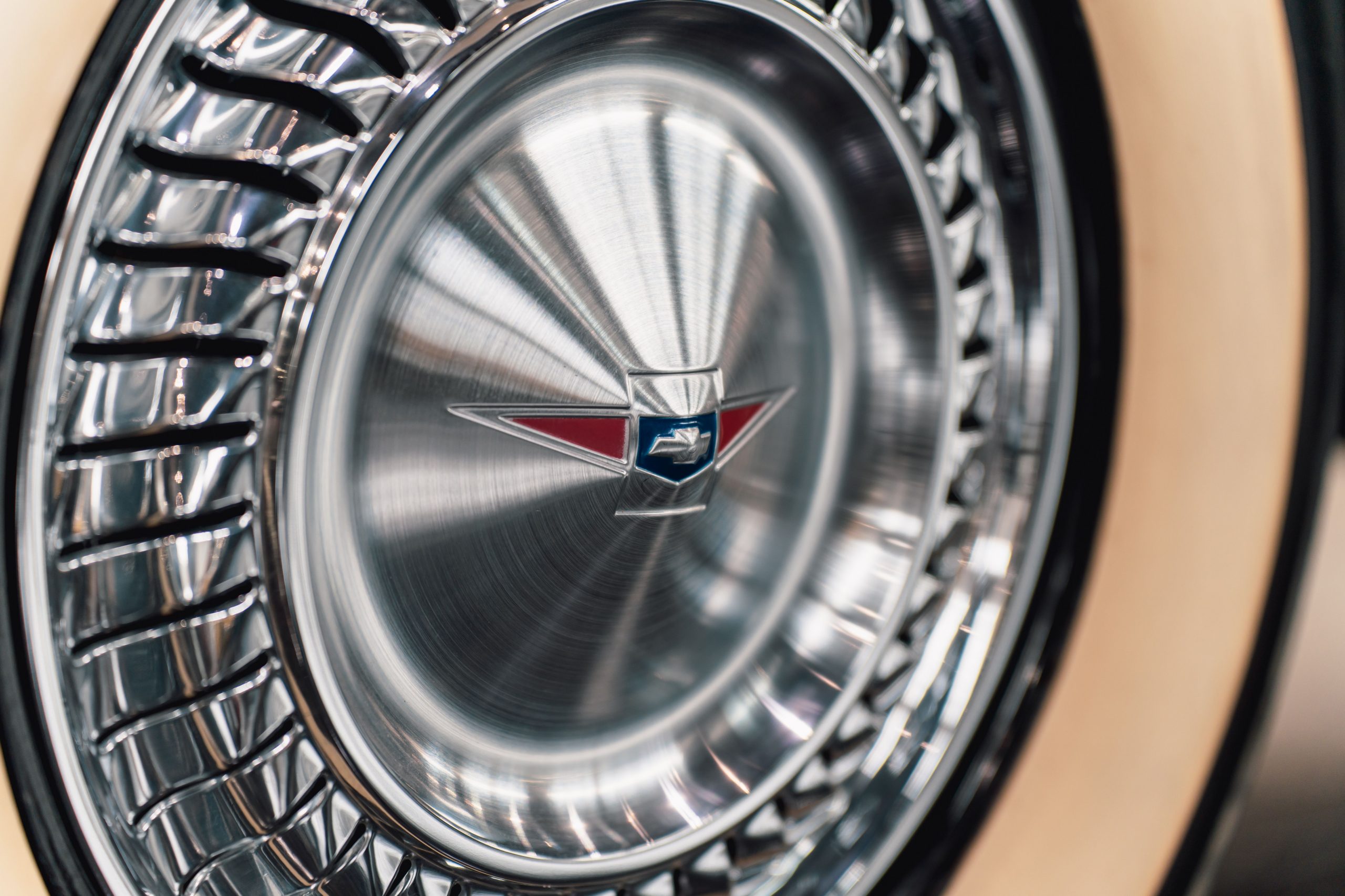 Close up of vintage car wheel hubcap design