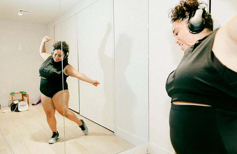 plus size dancer jessie diaz watches herself dance in her mirror